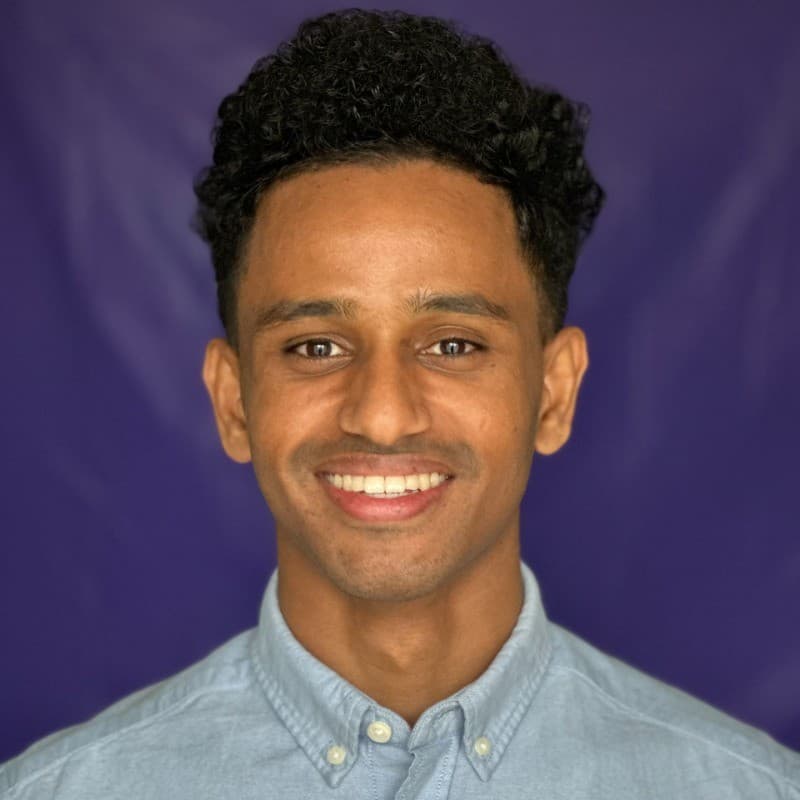 Hermon working with a client